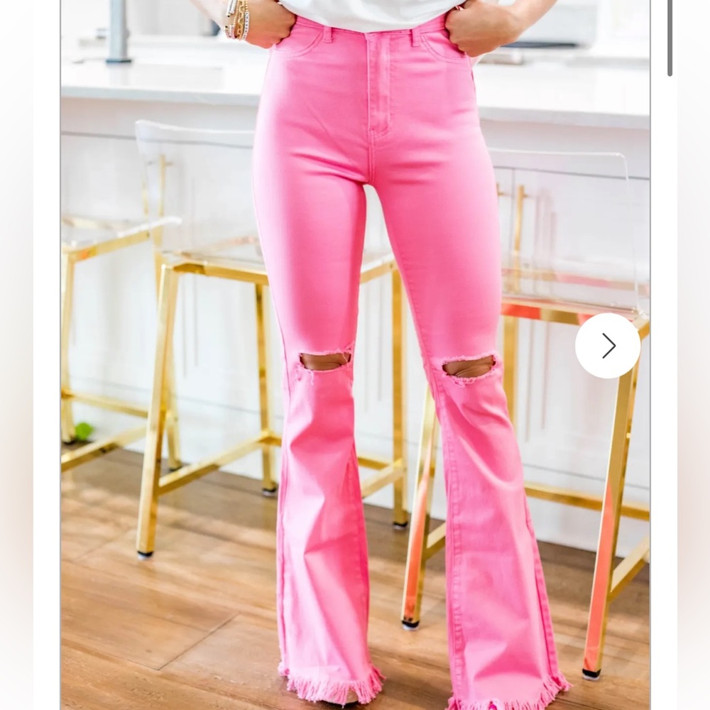 Pink colored ripped knee jeans. new size 12. Can fit 8-12